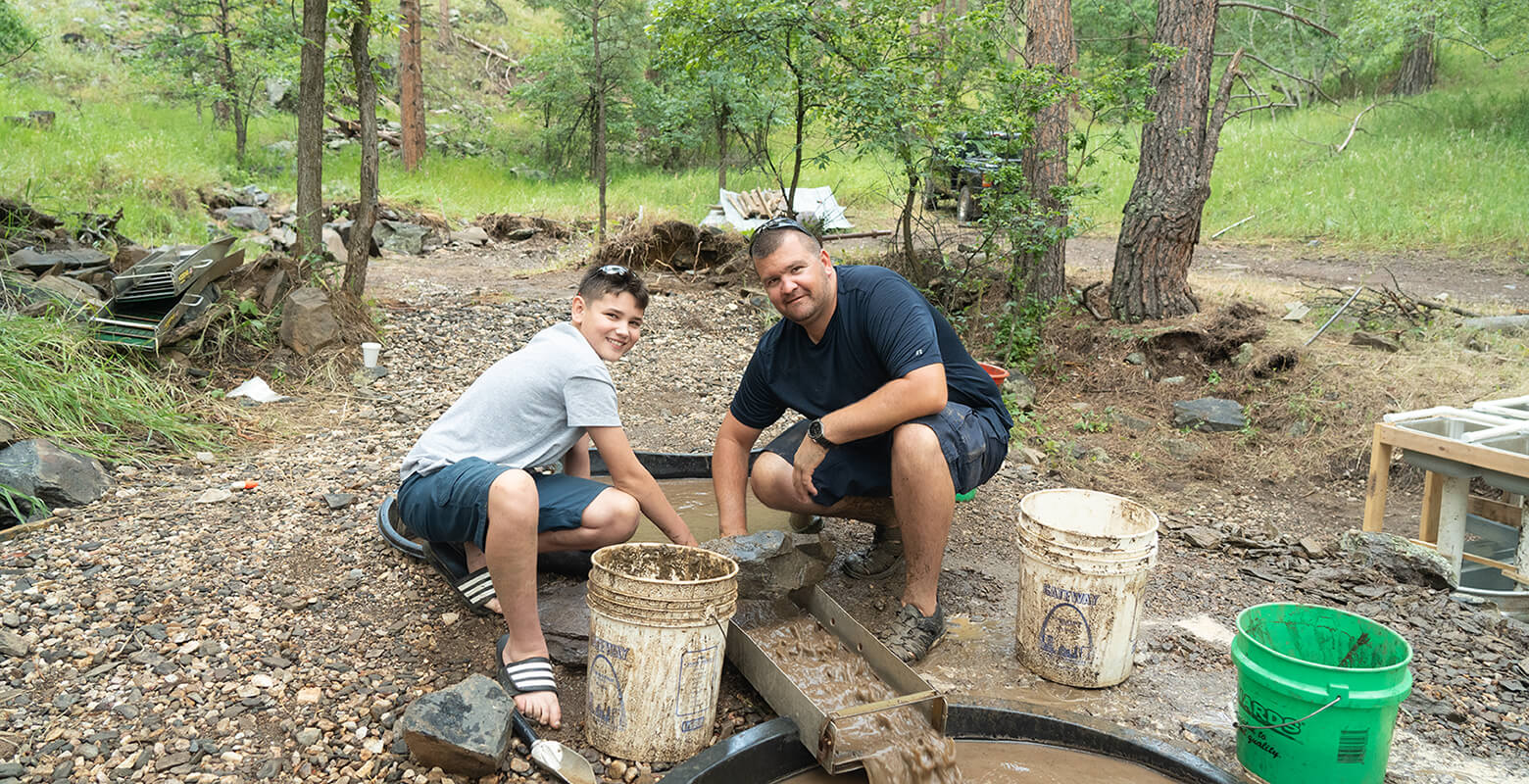 father and son gold panning