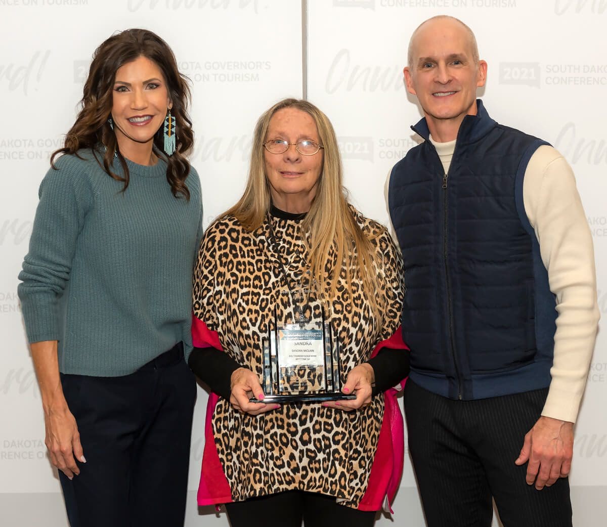 South Dakota Governor Kristi Noem with Sandi McLain of Big Thunder Gold Mine receiving the George S. Mickelson Award.