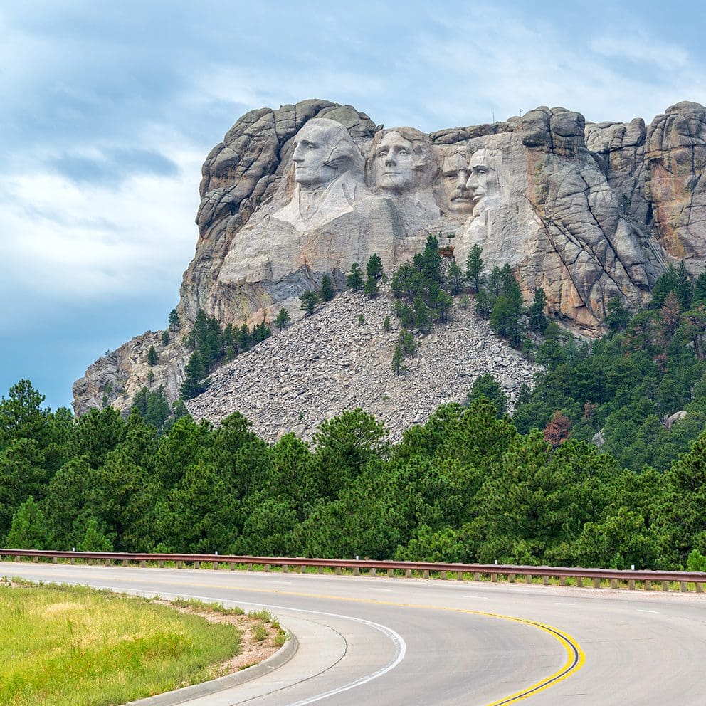 Scenic view of Mount Rushmore monument from the highway road in Keystone, South Dakota.