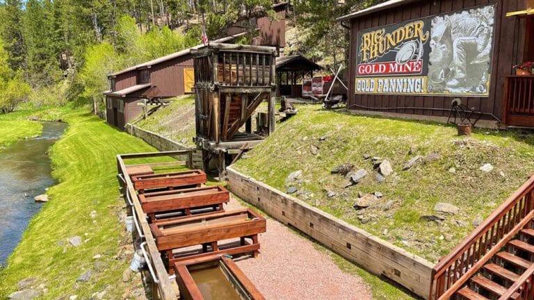Big Thunder Gold Mine in Keystone South Dakota showing the outdoor gold panning troughs next to a creek.