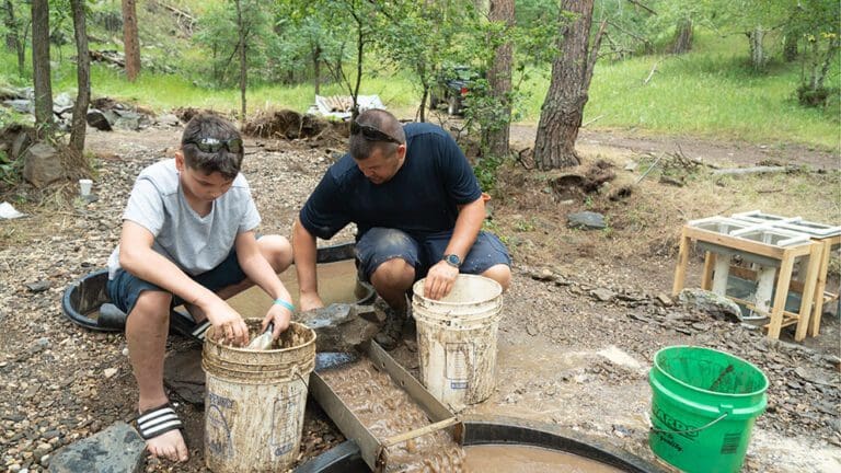 Father and son gold panning at Big Thunder Gold Mine in Keystone, SD.