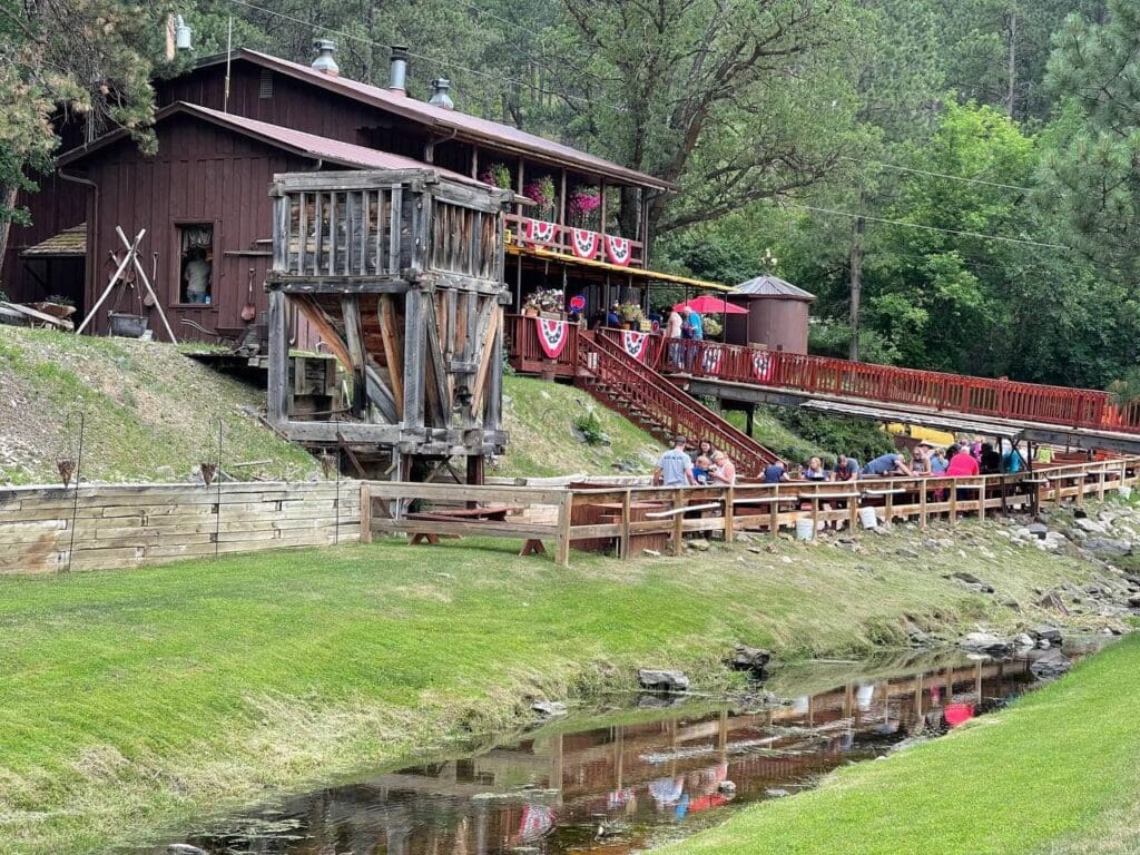 Historic Big Thunder Gold Mine building and outdoor gold panning in Keystone SD near Mount Rushmore.