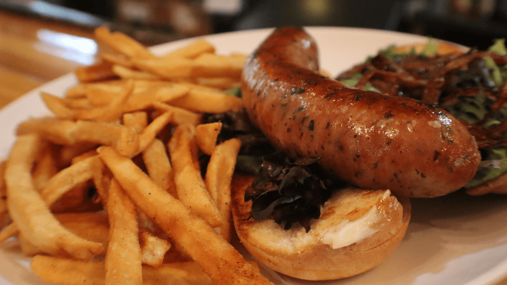 Snake and Rabbit exotic bratwurst on a hoagie bun with grilled onions and lettuce at Big Thunder Bar & Grille in Keystone, SD.